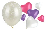 Hochzeitsballon Just Married transparent mit weißen Motiven und Herzballons in Weiß, Pink und Lila für romantische Deko